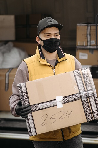 Mover with a covid mask
