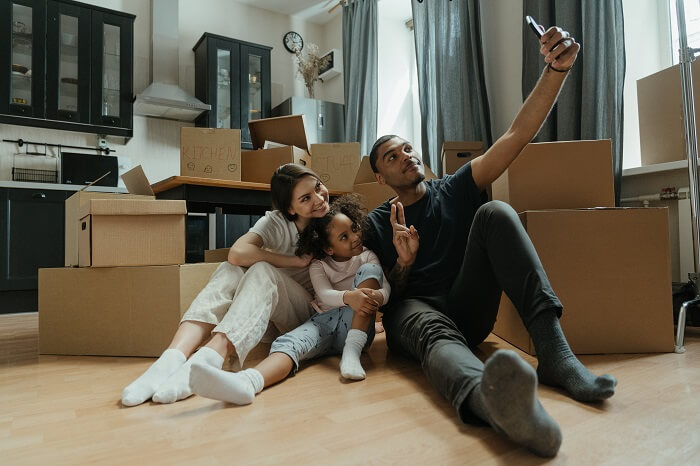 Family taking a selfie while unpacking
